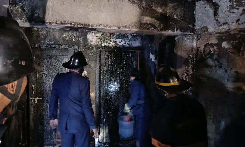 Firefighters using ladders and equipment to rescue trapped residents from a multi-storey building in Thane