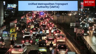 A busy city crossroad in Ahmedabad with Metro rail, BRTS bus, and private vehicles moving systematically.